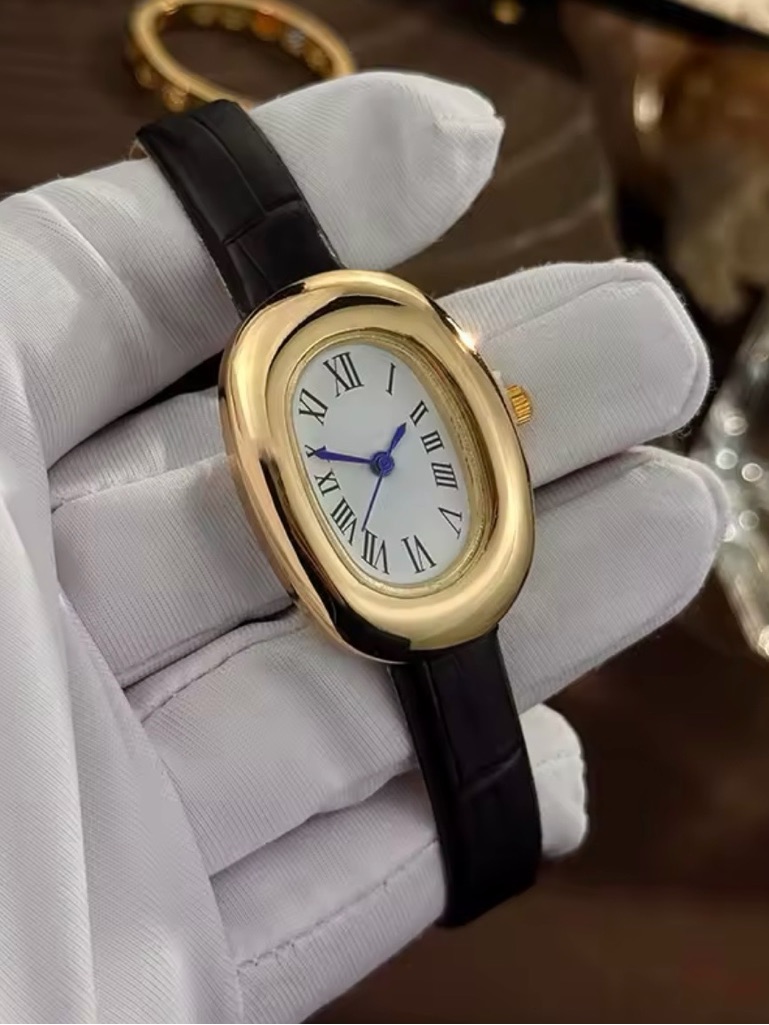 Macys Gold Oval Watch With Black Leather Strap